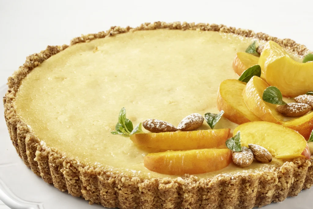 Pay de queso con duraznos de California